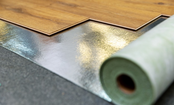 laminate flooring being installed over underlay