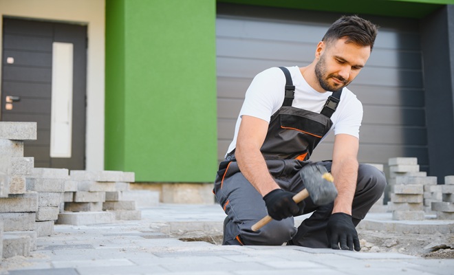 Man laying driveway