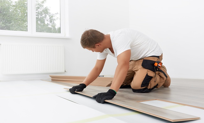 Man laying laminate