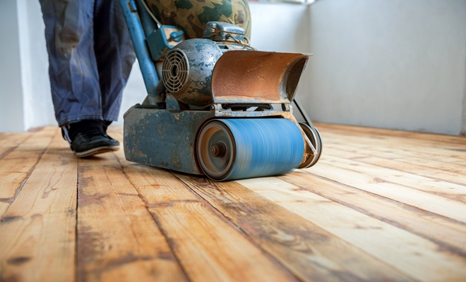 Person sanding floor