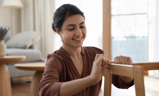 woman assembling a chair