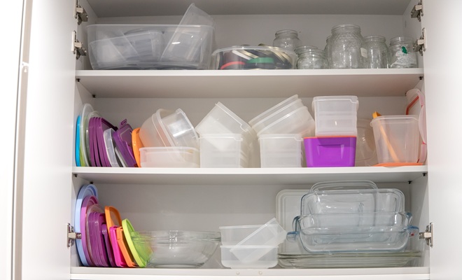 Kitchen cupboard full of tupperware