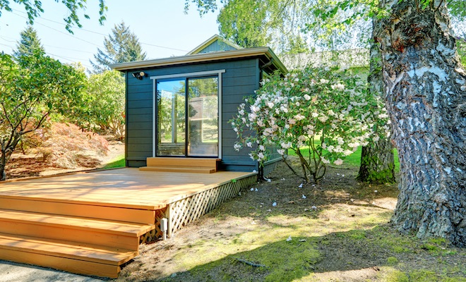 modern style garden office surrounded by aggregate