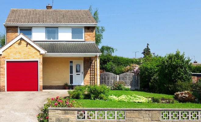detached house with prominent red garage