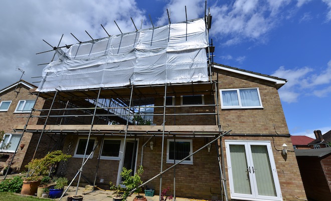 large scaffold tower at rear of house