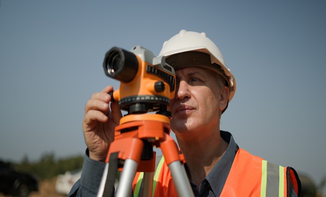 Man with survey equipment
