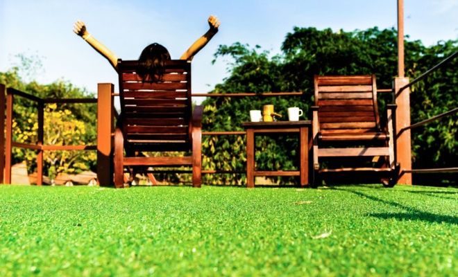 wooden chairs and artificial grass seen from ground level