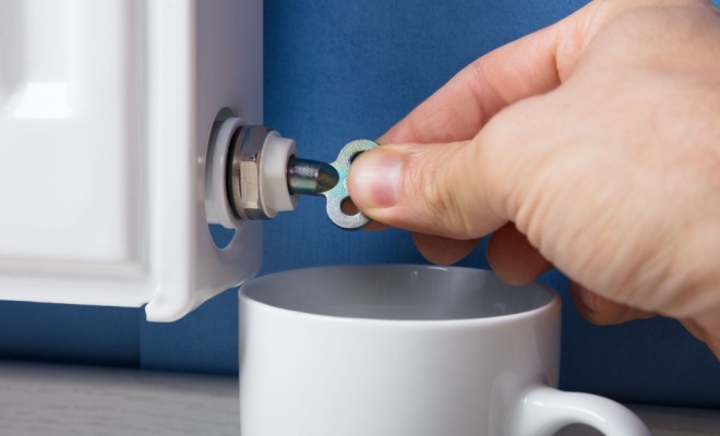 Hand turning valve on the side of the radiator
