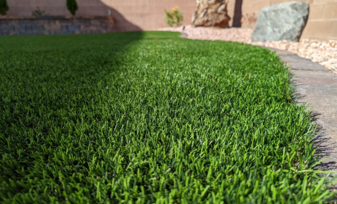 Artificial grass and flower beds