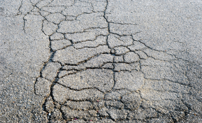 Damaged tarmac driveway