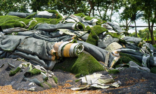 removed turf rolled into a large pile