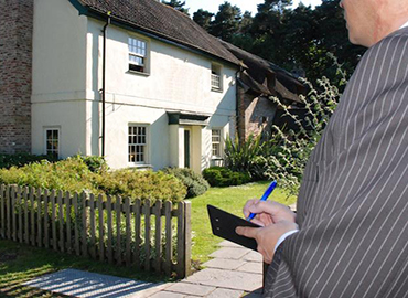 person inspecting house