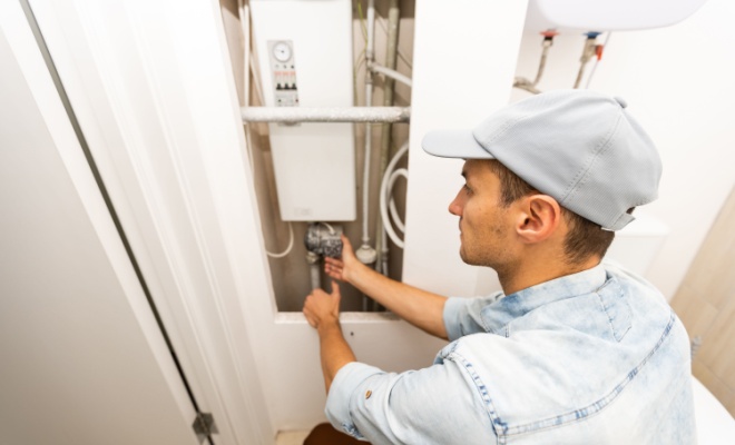 plumber working on boiler