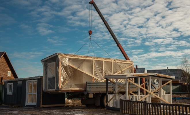 prefab unit being lowered by crane