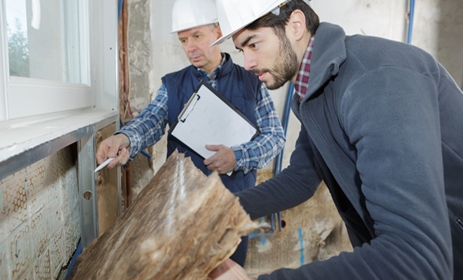man removing insulation