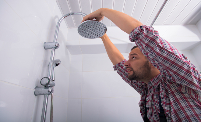 person installing shower