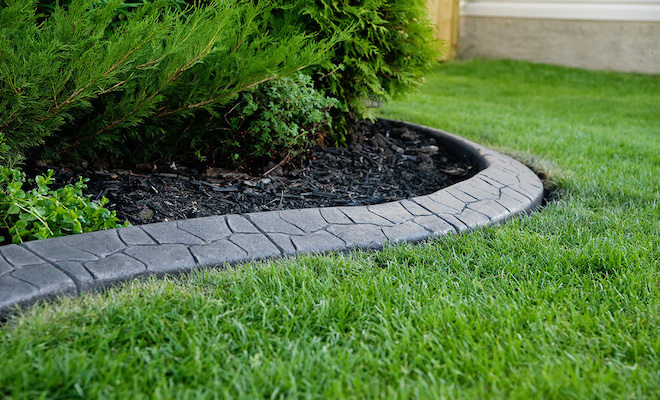Artificial grass and flower beds