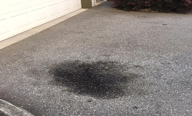 Oil stained tarmac driveway