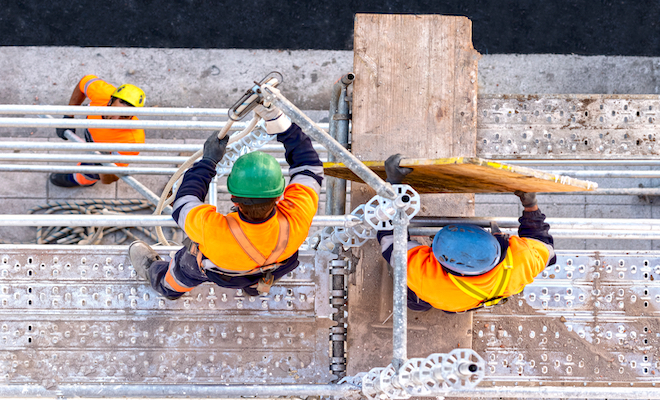 two people on scaffolding