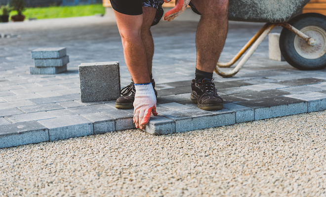 person installing a patio