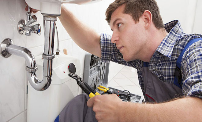 Plumber fitting a bathroom