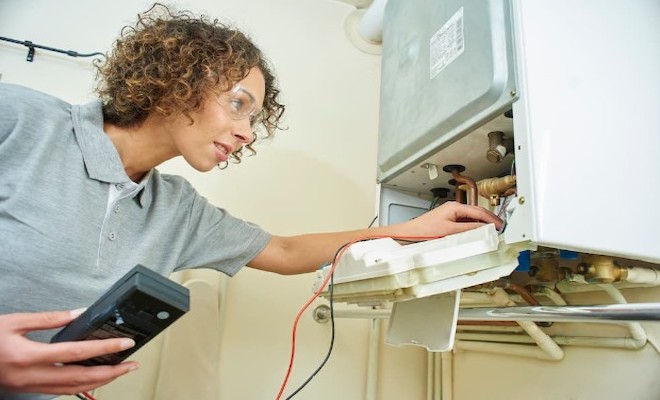 Tradesperson installing a boiler