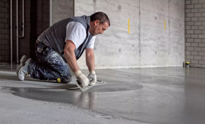 Man screeding floor