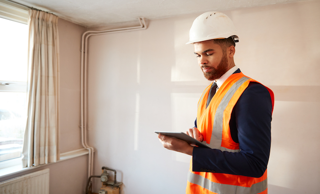 man conducting a structural survey