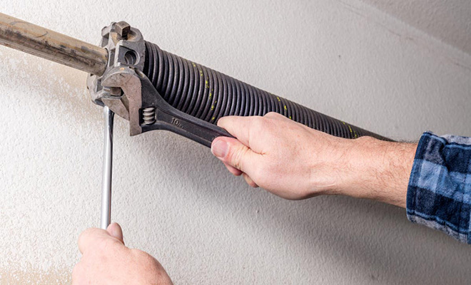 Removing a garage door spring