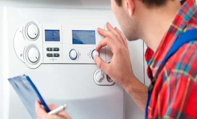 Tradesperson checking a boiler