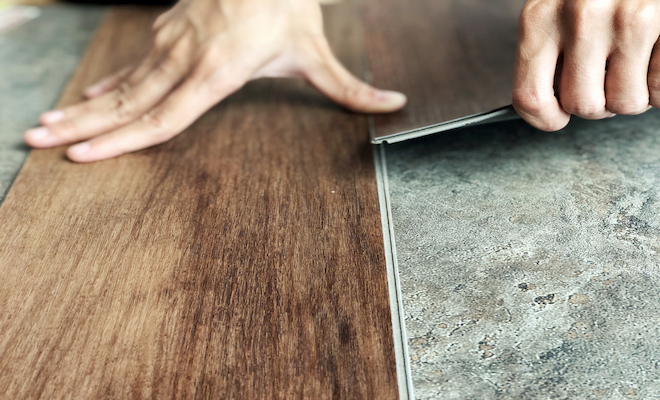 person fitting vinyl flooring