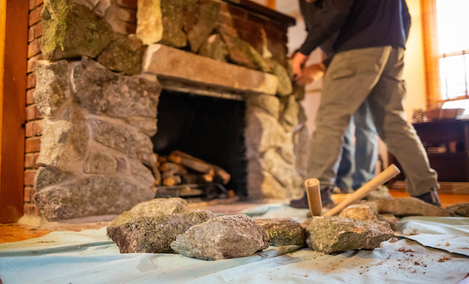 stone fireplace being taken down