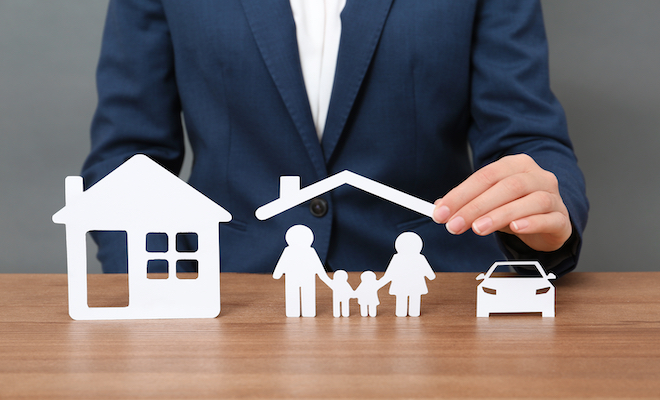 man holding roof over family