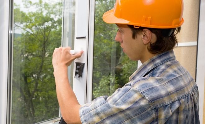 Window fitter fitting a window