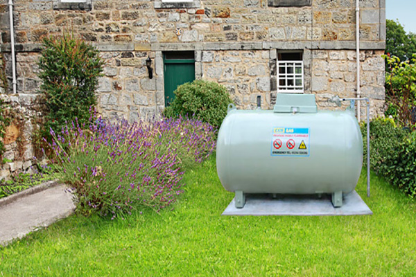 lpg tank behind stone cottage
