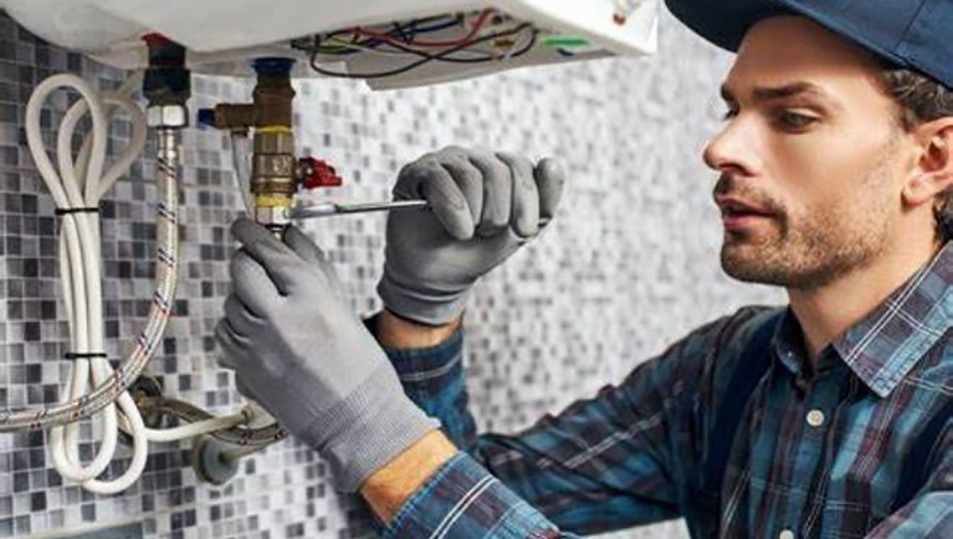 Man servicing a boiler