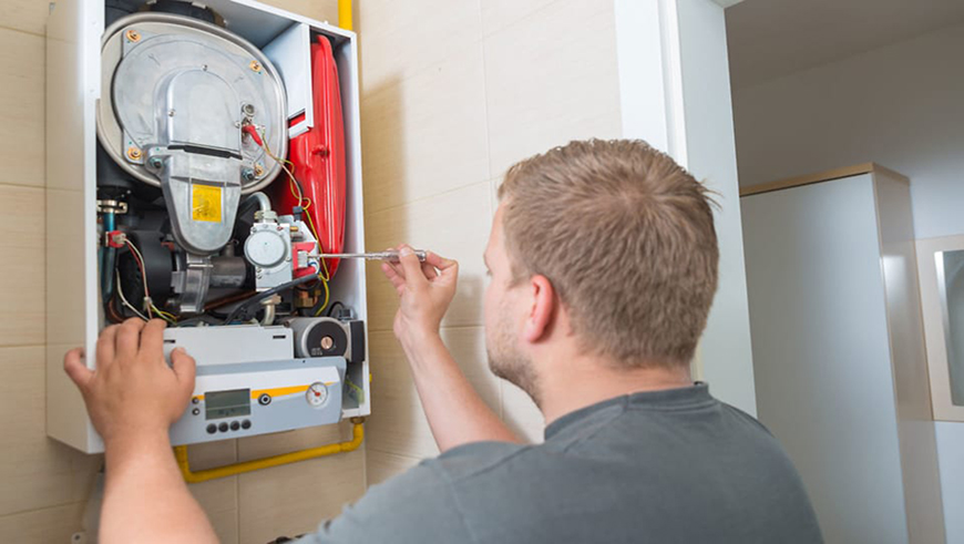 Man fitting boiler