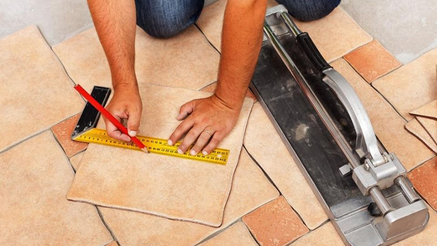 Tiler laying tiles